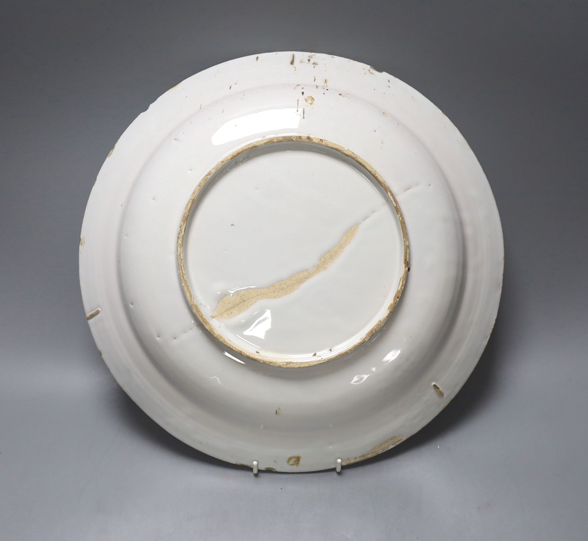 An 18th century Delft polychrome dish 35cm